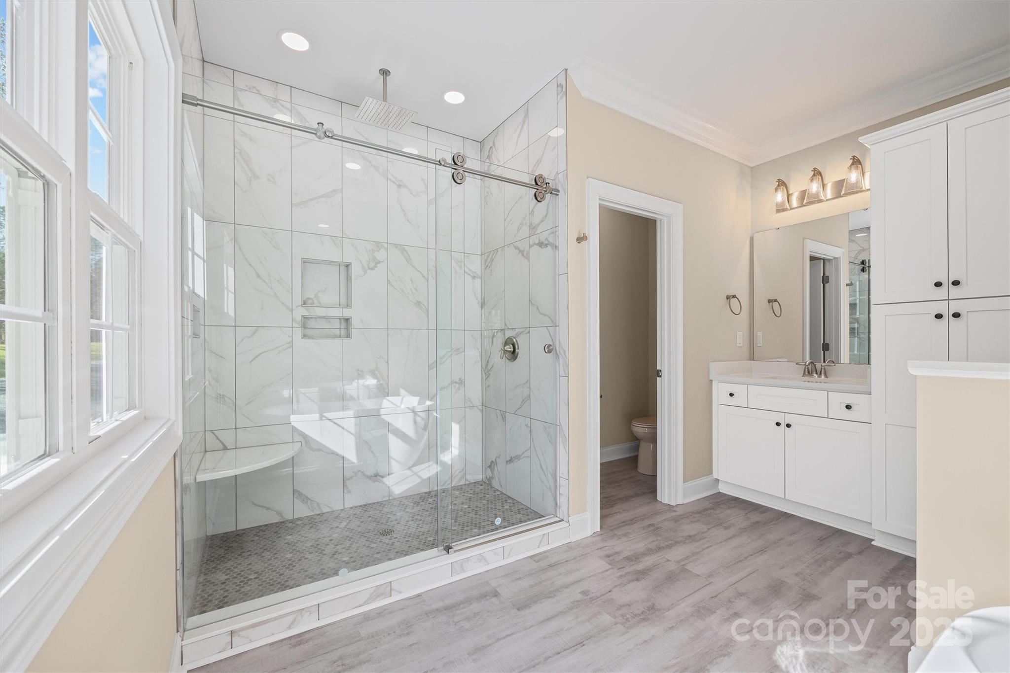 3812 Winter Road, Unit 5 Rock Hill, SC 29730 - Photo 26 of 37 a spacious bathroom with a shower sink and mirror