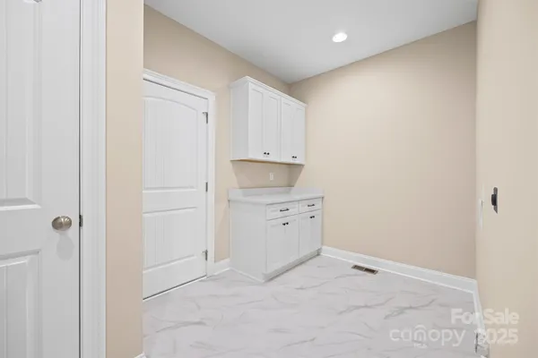 a bathroom with a sink a mirror and a window