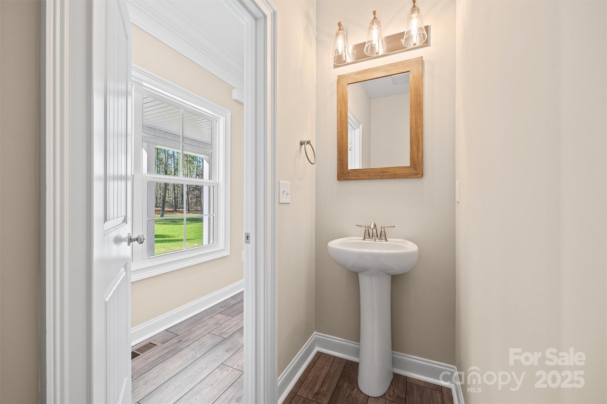 3812 Winter Road, Unit 5 Rock Hill, SC 29730 - Photo 28 of 37 a bathroom with a sink a mirror and a window
