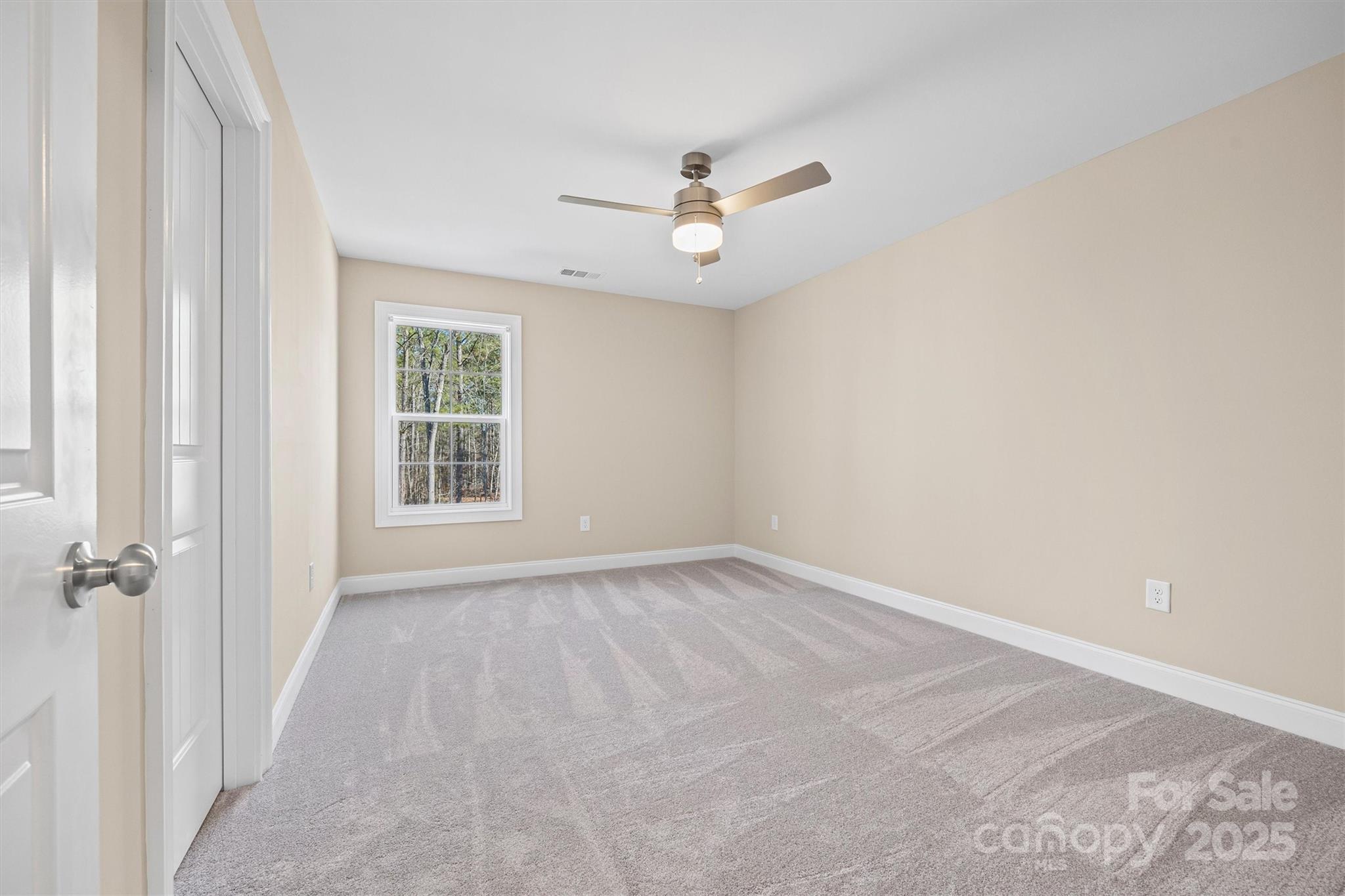 3812 Winter Road, Unit 5 Rock Hill, SC 29730 - Photo 32 of 37 an empty room with windows and fan