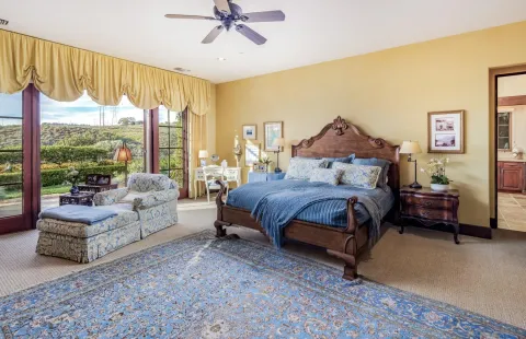 a bedroom with a bed and a couch
