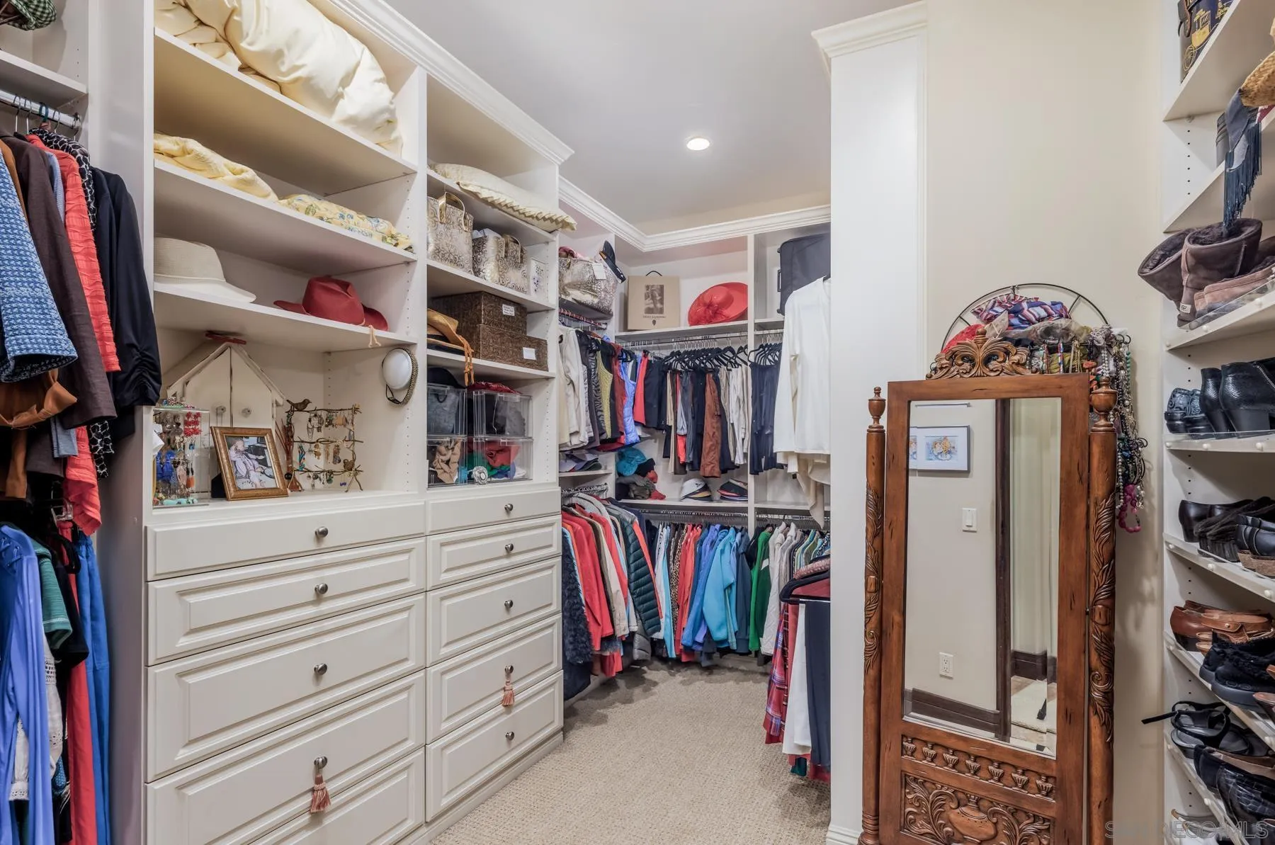 18669 Via Catania Rancho Santa Fe, CA 92091 - Photo 18 of 39 a view of walk in closet with clothes and shoes