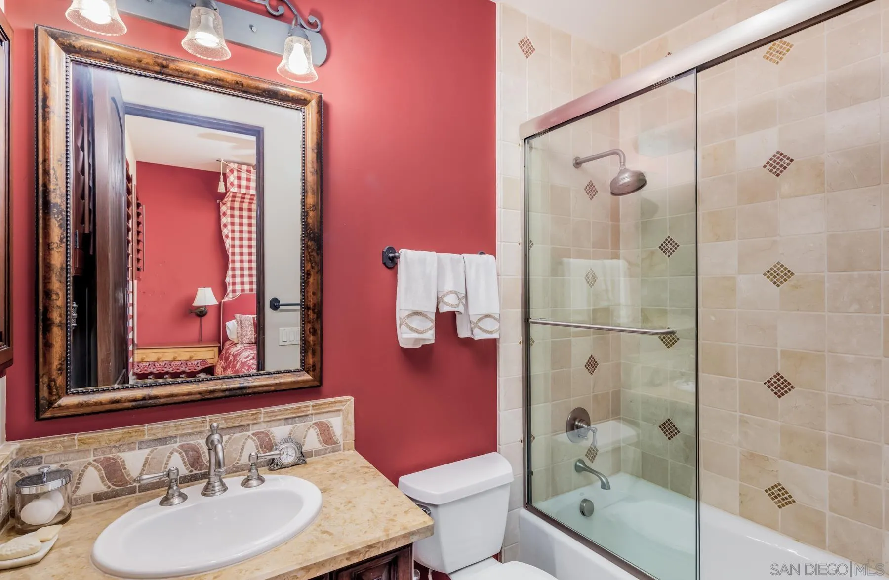 18669 Via Catania Rancho Santa Fe, CA 92091 - Photo 22 of 39 a bathroom with a sink shower and a mirror