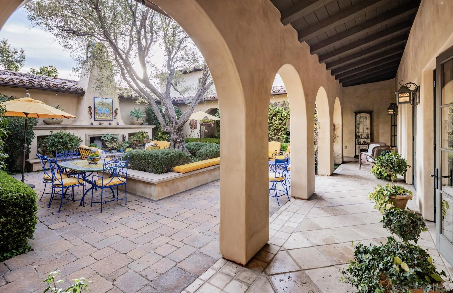 18669 Via Catania Rancho Santa Fe, CA 92091 - Photo 38 of 39 a view of a patio with table and chairs near a barbeque