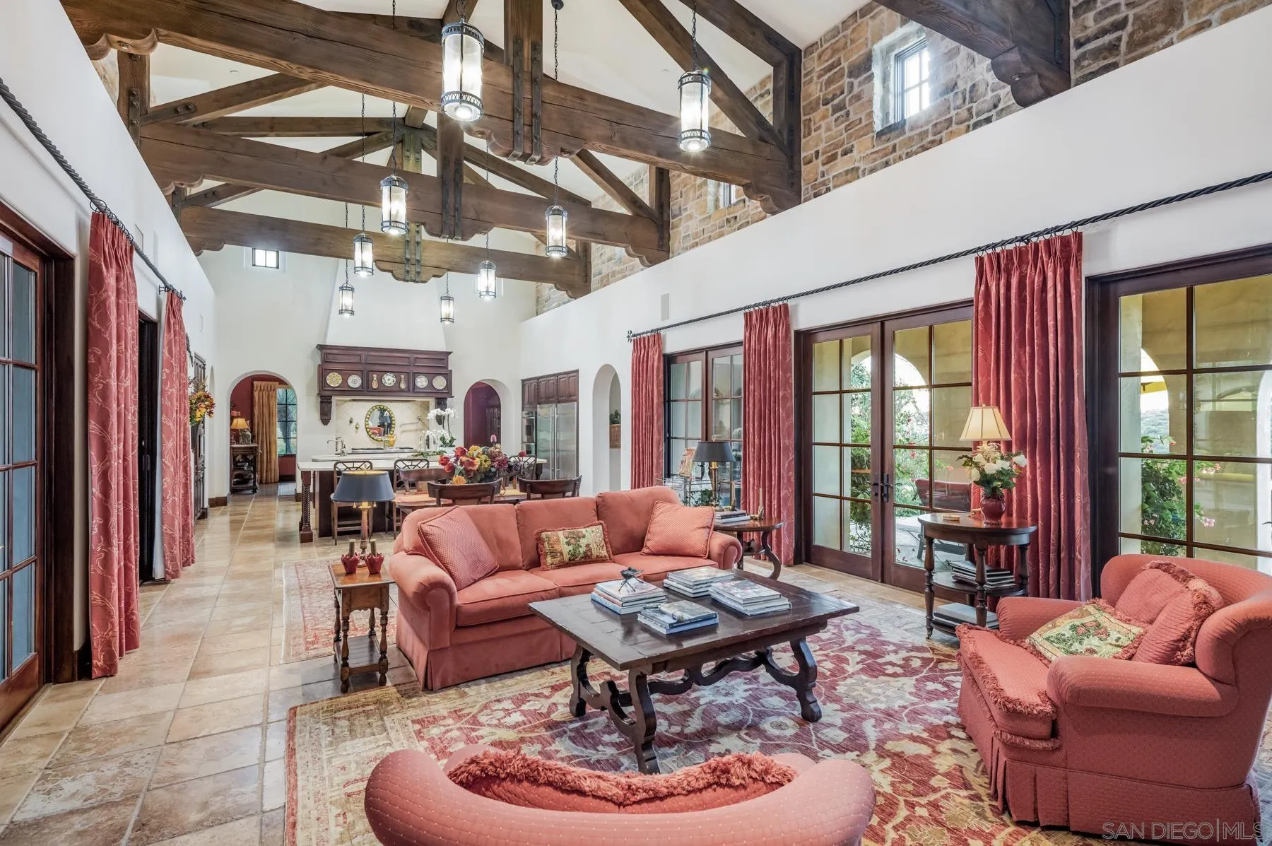 18669 Via Catania Rancho Santa Fe, CA 92091 - Photo 8 of 39 a living room with furniture a fireplace and a chandelier