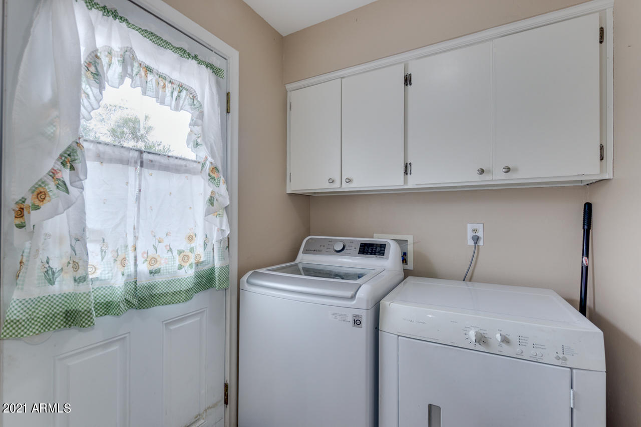 4215 West Dailey Street Phoenix, AZ 85053 - Photo 22 of 32 a utility room with dryer and washer