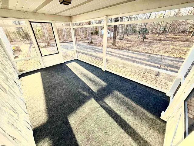 a view of a living room with a large window