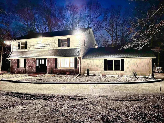 a living room with a couch and a fireplace