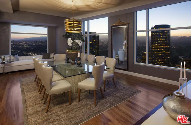 a dining room with furniture window and wooden floor