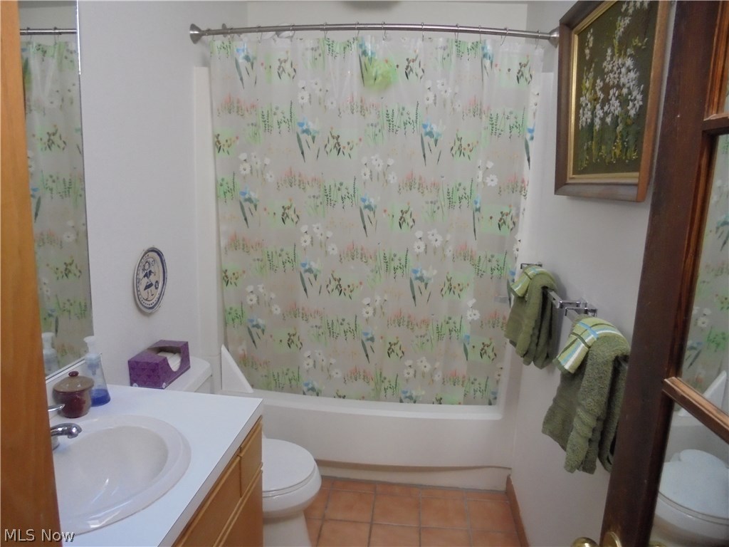 25014 Lake Road Bay Village, OH 44140 - Photo 13 of 35 Hallway bathroom with linen cabinet and tub/shower combination.