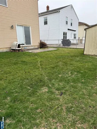 a view of a house with backyard