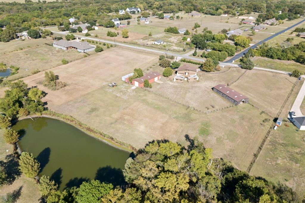 600 Long Road Lucas, TX 75002 - Photo 3 of 4 an aerial view of a house with a yard and lake view