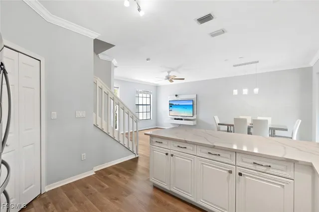 a view with a sink and a mirror in a room