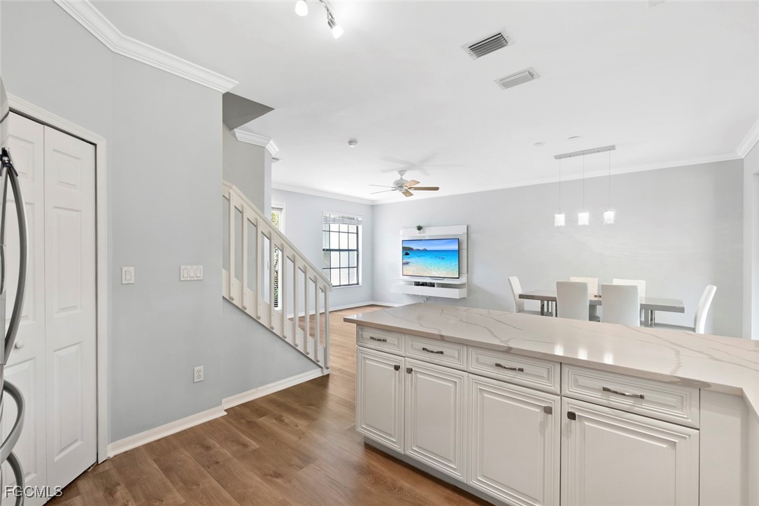 14617 Sutherland Avenue, Unit 80 Naples, FL 34119 - Photo 13 of 46 a view with a sink and a mirror in a room