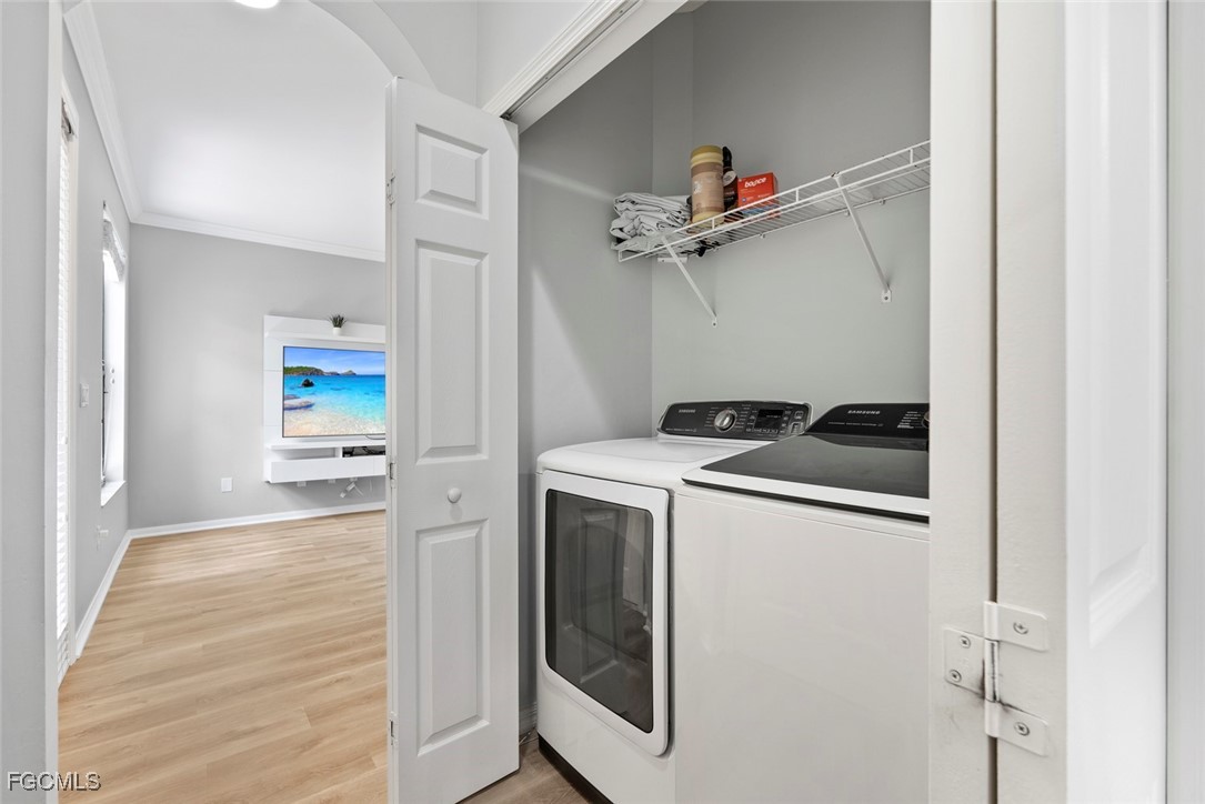 14617 Sutherland Avenue, Unit 80 Naples, FL 34119 - Photo 14 of 46 a view of a kitchen from a hallway