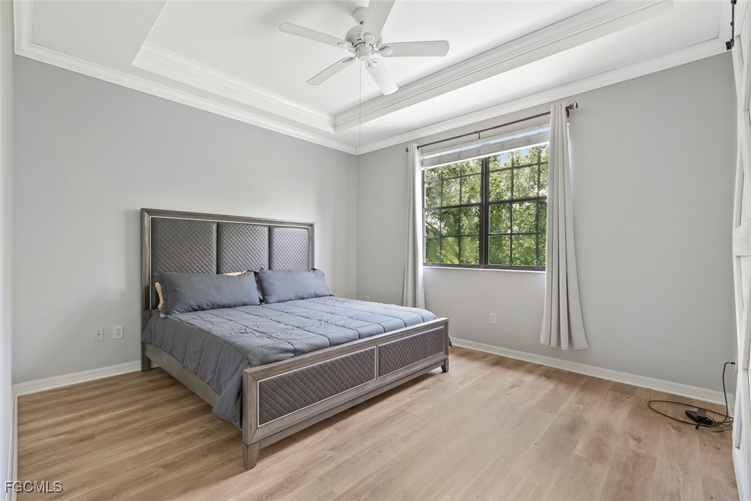 14617 Sutherland Avenue, Unit 80 Naples, FL 34119 - Photo 16 of 46 a bedroom with a bed and window