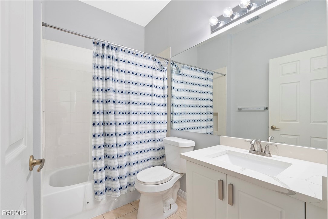 14617 Sutherland Avenue, Unit 80 Naples, FL 34119 - Photo 20 of 46 a bathroom with a sink toilet and shower