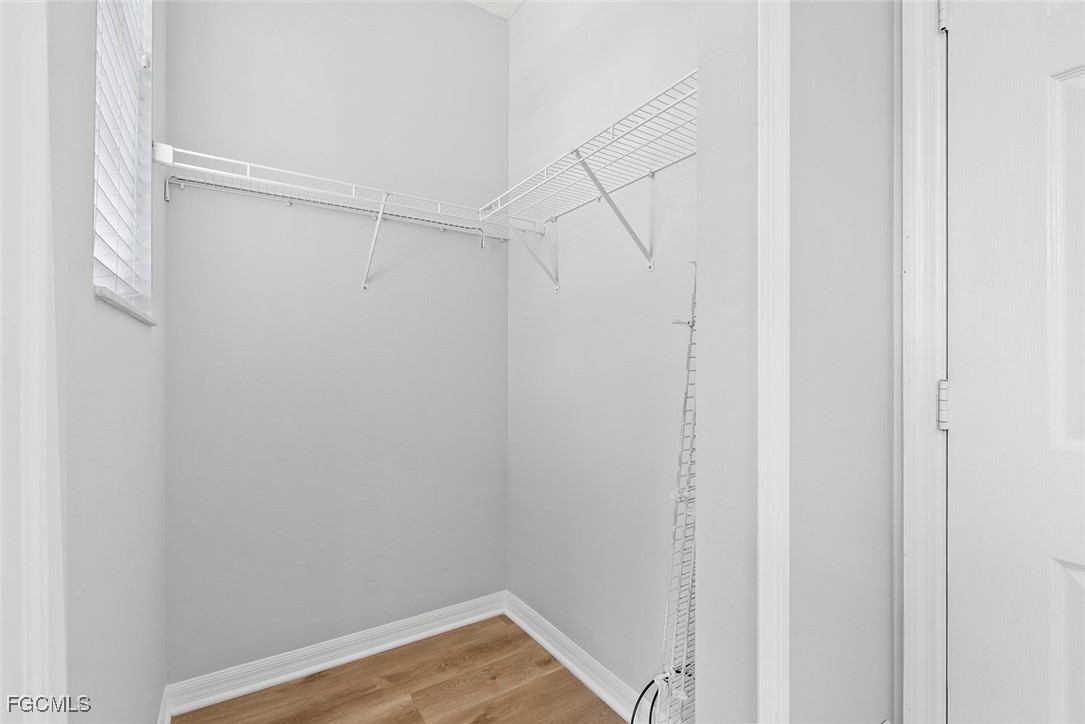 14617 Sutherland Avenue, Unit 80 Naples, FL 34119 - Photo 23 of 46 a view of small space with racks on the wall