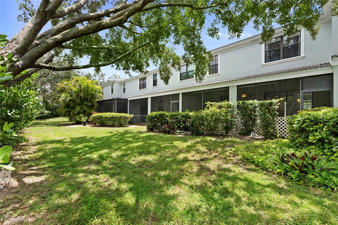 14617 Sutherland Avenue, Unit 80 Naples, FL 34119 - Photo 28 of 46 a house view with a garden space