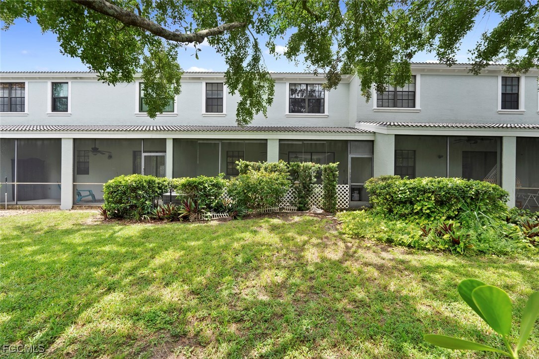 14617 Sutherland Avenue, Unit 80 Naples, FL 34119 - Photo 29 of 46 front view of house with a yard