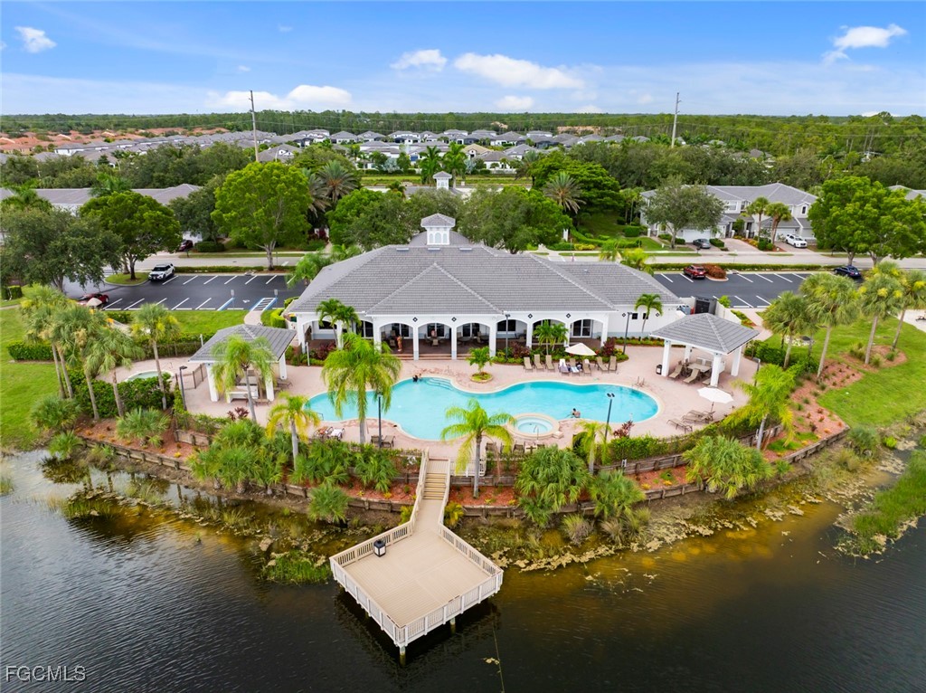 14617 Sutherland Avenue, Unit 80 Naples, FL 34119 - Photo 43 of 46 an aerial view of a house with a swimming pool patio and mountain view