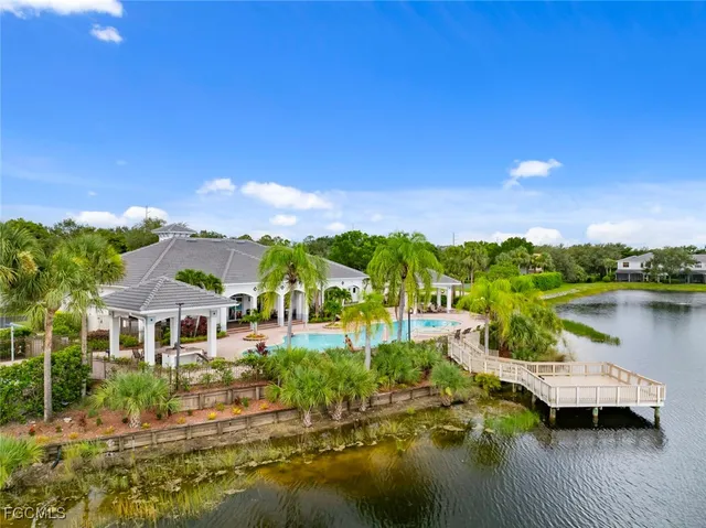 a view of a lake with a house in the background