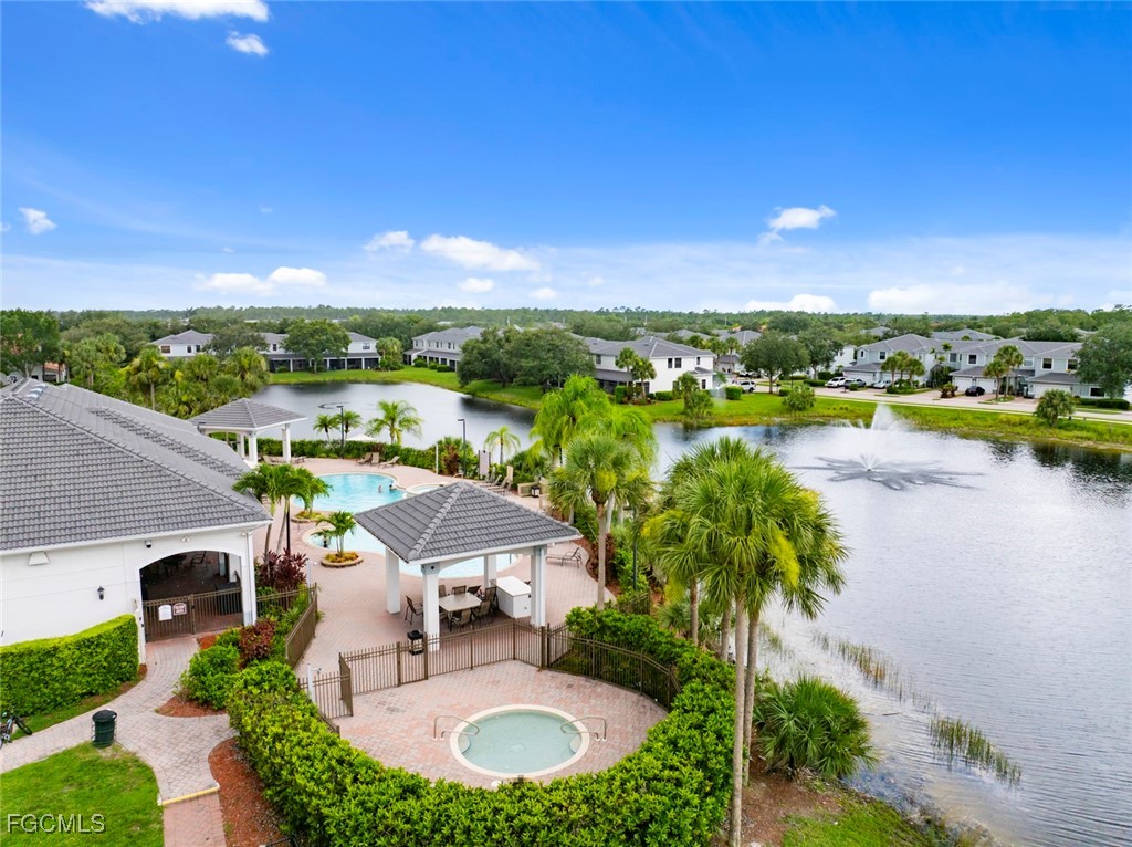 14617 Sutherland Avenue, Unit 80 Naples, FL 34119 - Photo 45 of 46 a view of swimming pool and lake view
