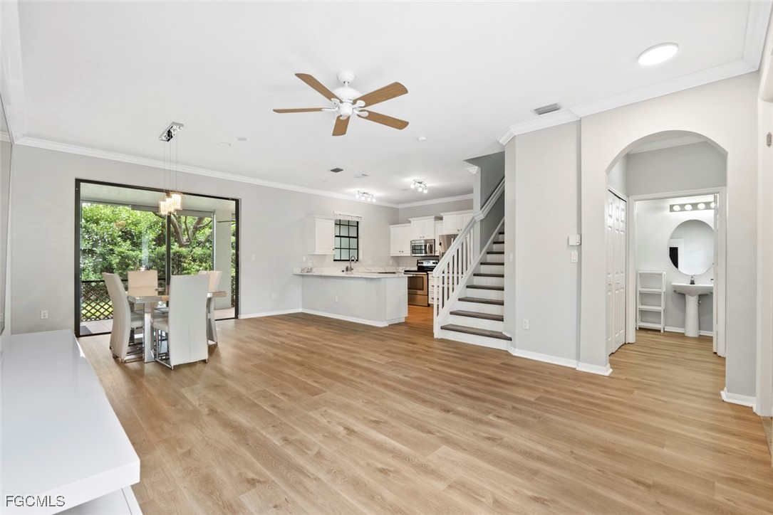 14617 Sutherland Avenue, Unit 80 Naples, FL 34119 - Photo 5 of 46 a view of a livingroom with wooden floor and furniture