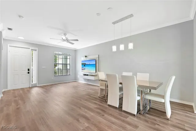 a view of a livingroom with a dinning table and chair