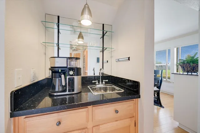 a view of a storage & utility room with a sink