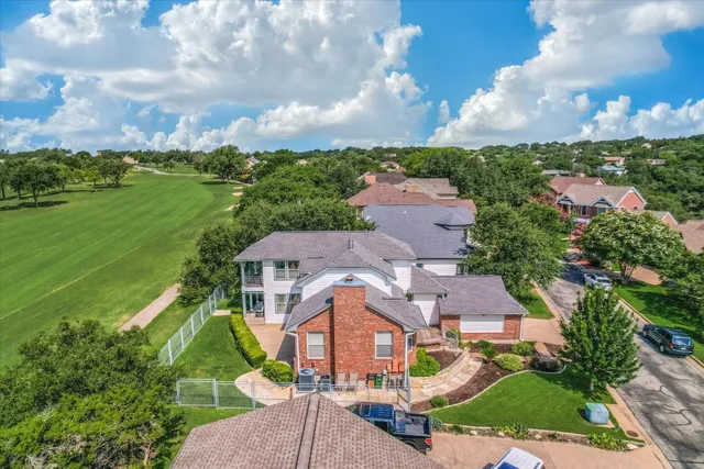 an aerial view of a house with a garden