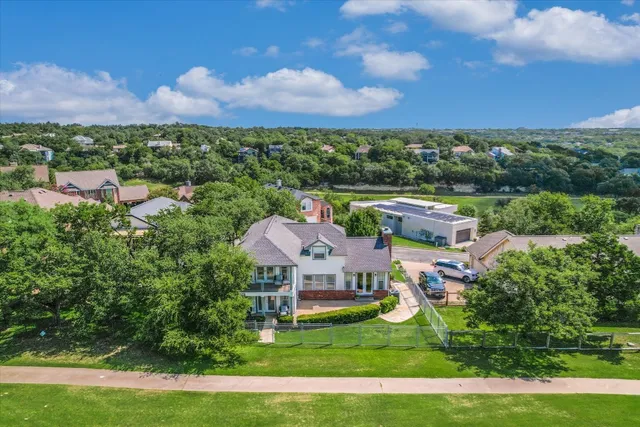 an aerial view of a house with a garden