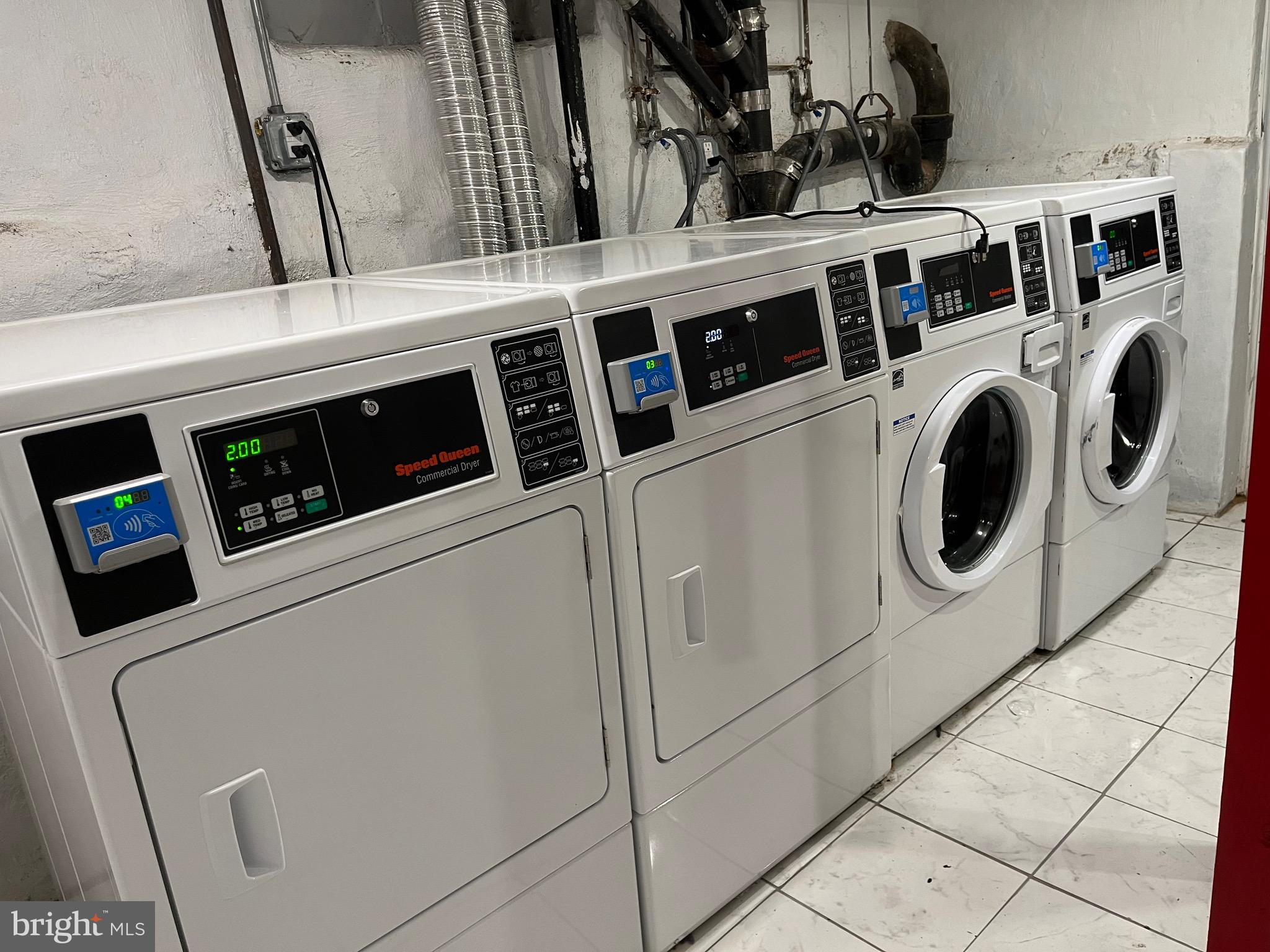 4508 Walnut Street, Unit 402 Philadelphia, PA 19139 - Photo 11 of 14 a utility room with dryer and washer