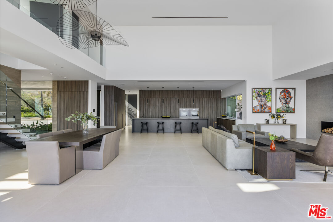 5601 Kanan Dume Road Malibu, CA 90265 - Photo 19 of 31 a large living room with stainless steel appliances kitchen island granite countertop furniture and a kitchen view