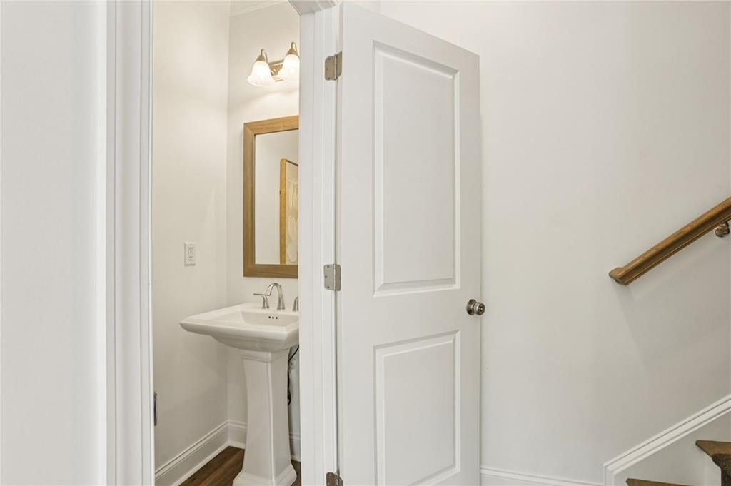 532 Alice Way, Unit D8 Cumming, GA 30040 - Photo 21 of 40 a bathroom with a sink and a mirror