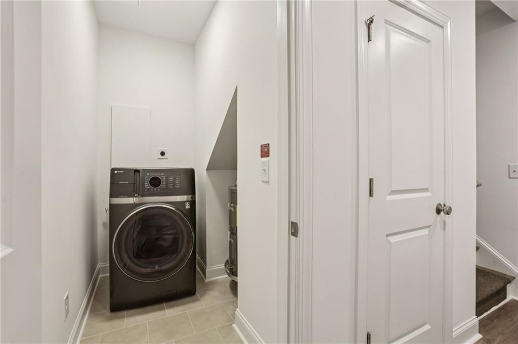 532 Alice Way, Unit D8 Cumming, GA 30040 - Photo 22 of 40 a room with a washer and dryer