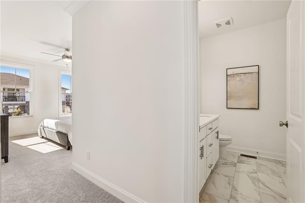 532 Alice Way, Unit D8 Cumming, GA 30040 - Photo 24 of 40 a spacious bathroom with a sink and a mirror