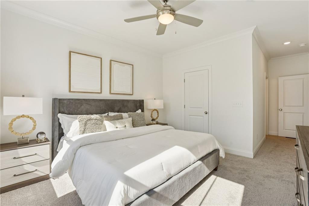 532 Alice Way, Unit D8 Cumming, GA 30040 - Photo 31 of 40 a bedroom with a bed and wooden floor