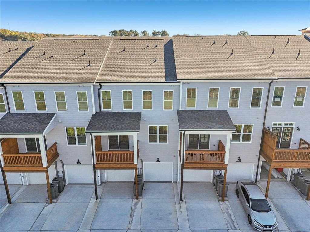 532 Alice Way, Unit D8 Cumming, GA 30040 - Photo 35 of 40 a front view of a house with a yard