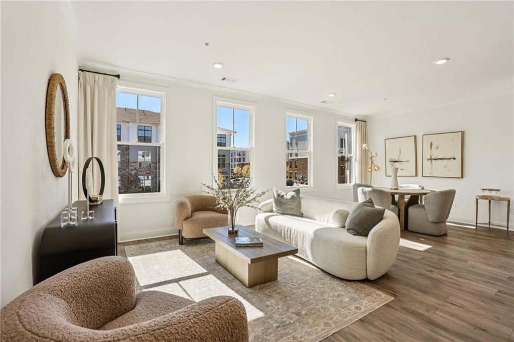 532 Alice Way, Unit D8 Cumming, GA 30040 - Photo 10 of 40 a living room with furniture and a large window