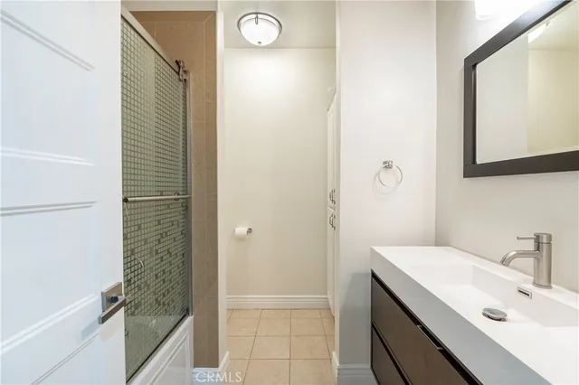 a view of a room with wooden floor and cabinet