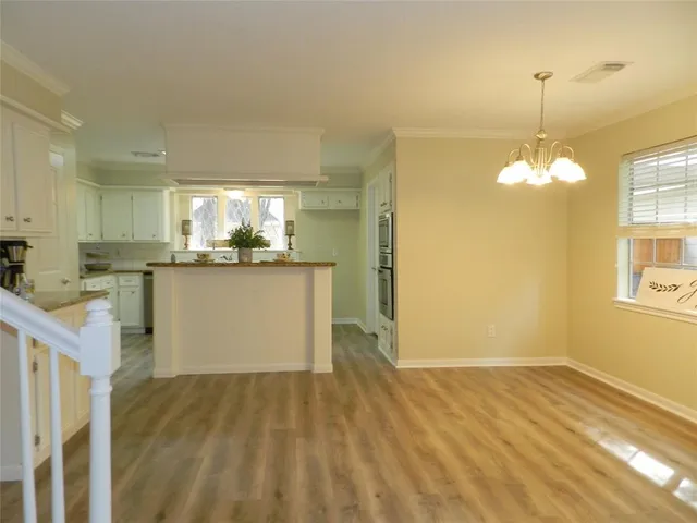 a kitchen with a sink cabinets and window