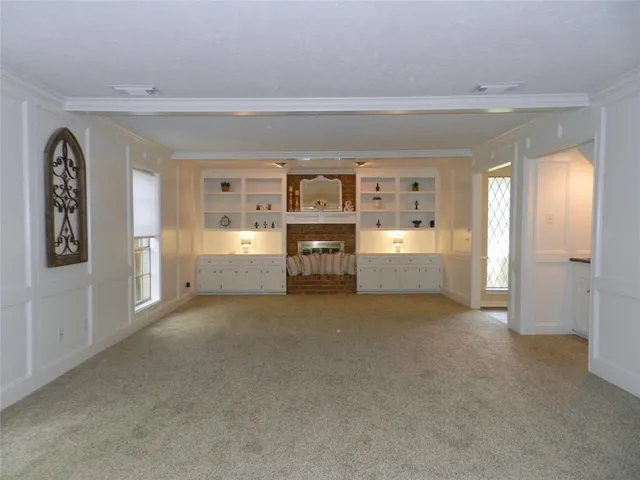 a view of a big room with wooden cabinet and cabinet