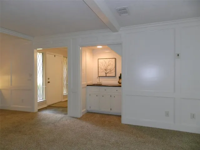 an empty room with mirror