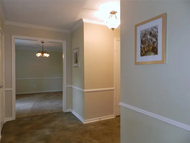 an empty room with wooden floor and closet