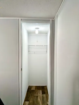 a bedroom with a bed and a cabinets