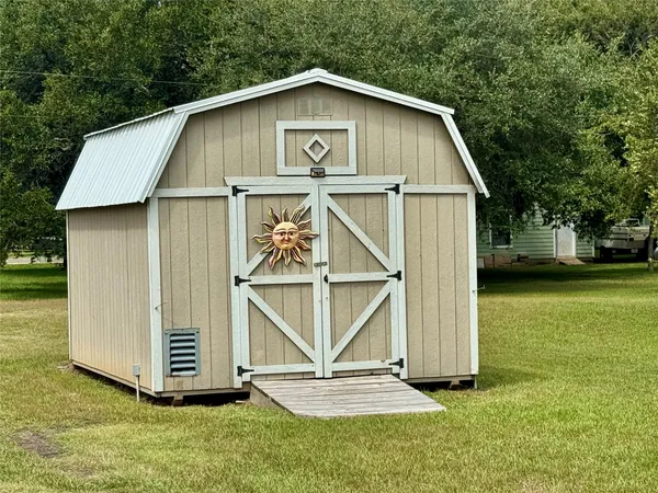 a view of a tiny house with a yard