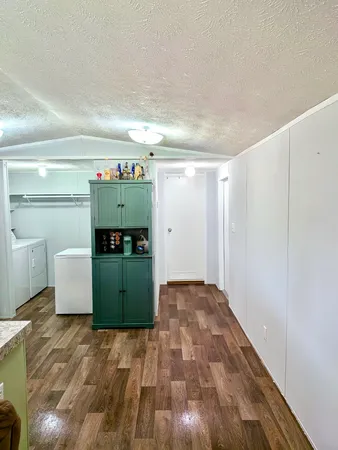 a room with a washing machine and closet