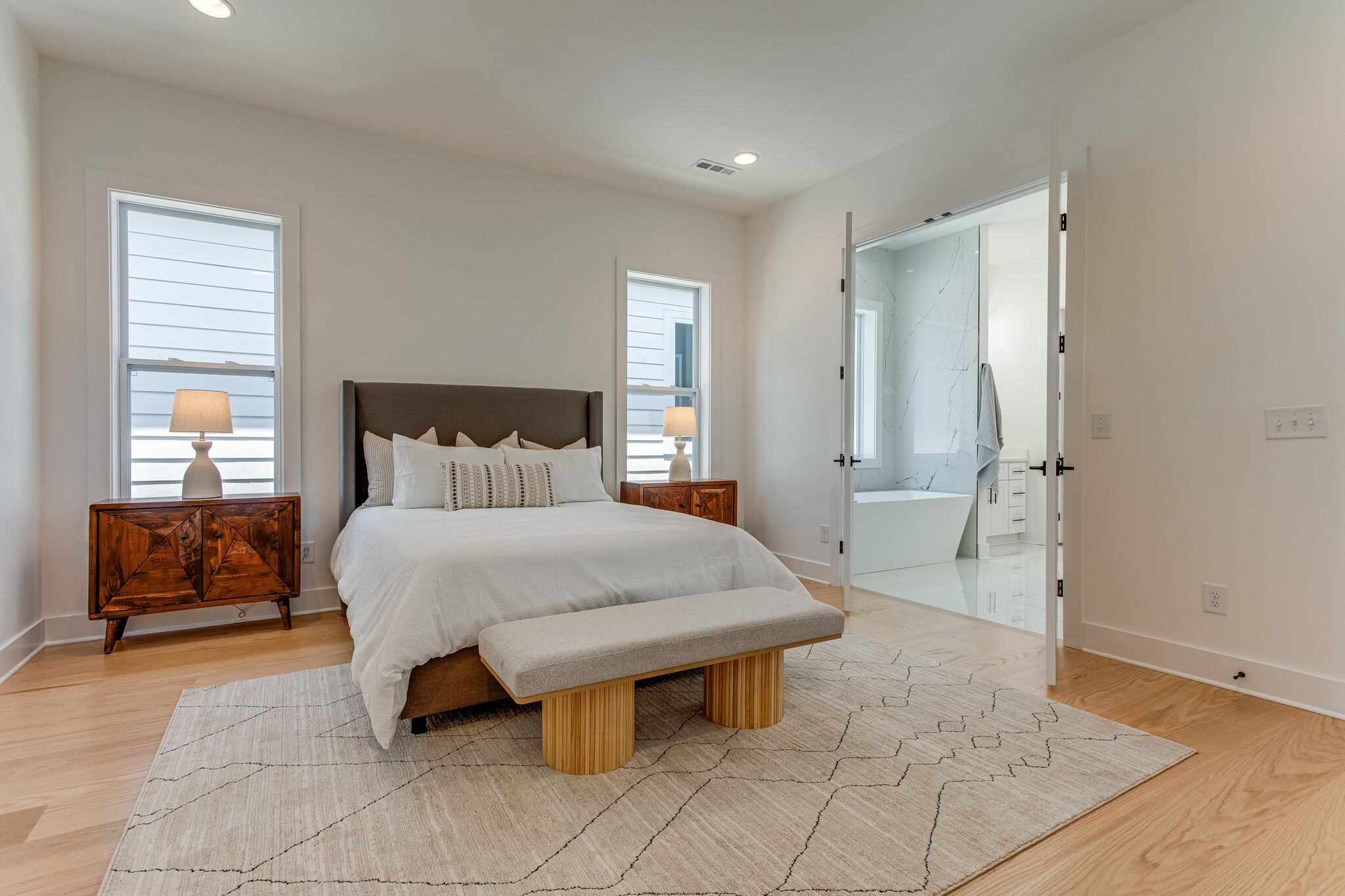 6203 A Morrow Road Nashville, TN 37209 - Photo 14 of 18 a bedroom with a bed and wooden floor