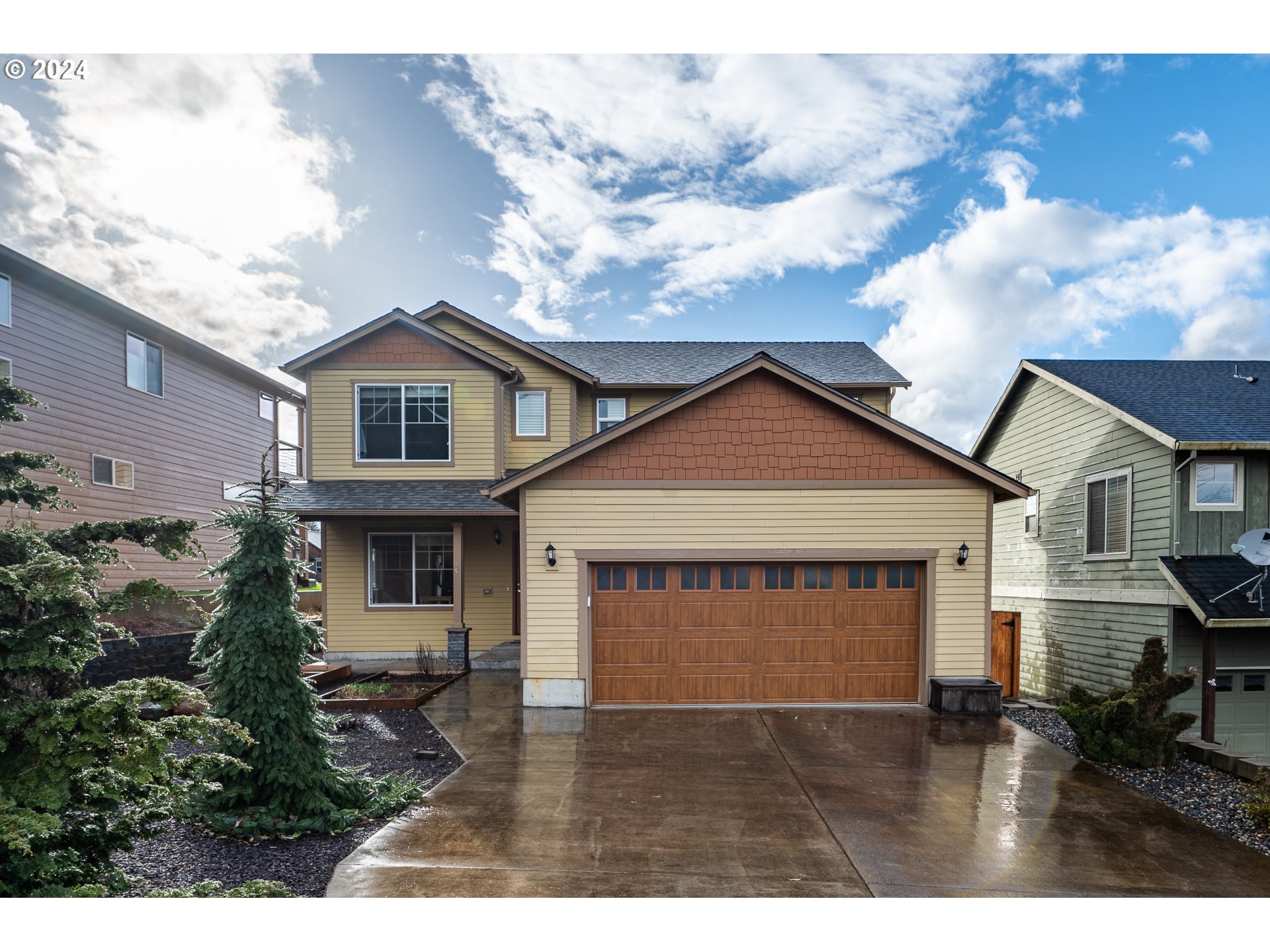 a view of house with a garden and pathway